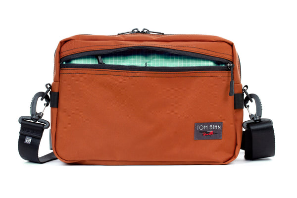 The Side Hustle in Burnt Orange Ballistic with Seafoam 200 Halcyon interior.